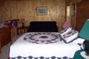 Queen size bed with futon in the Loft area